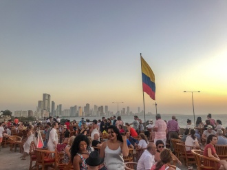 Sunset at Cafe Del Mar with Colombian flag